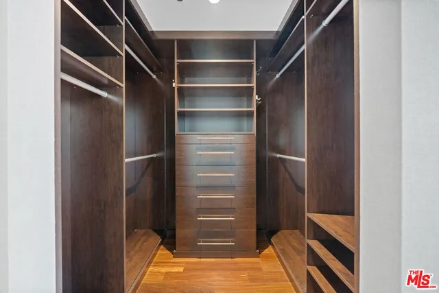 a bathroom with a shower sink and mirror