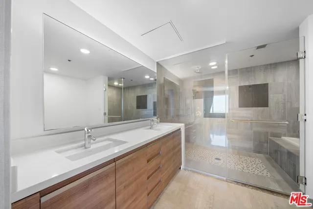 a view of an empty room and wooden floor