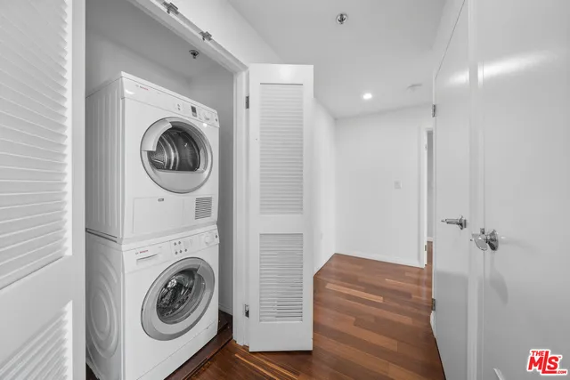 a room with wooden floor and furniture