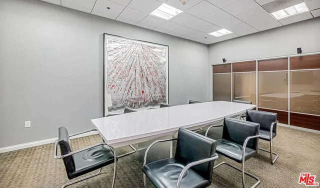 a living room with furniture and a chair