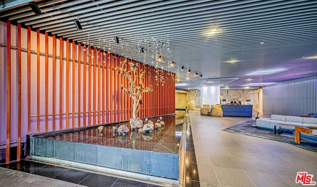 a lobby with furniture and window