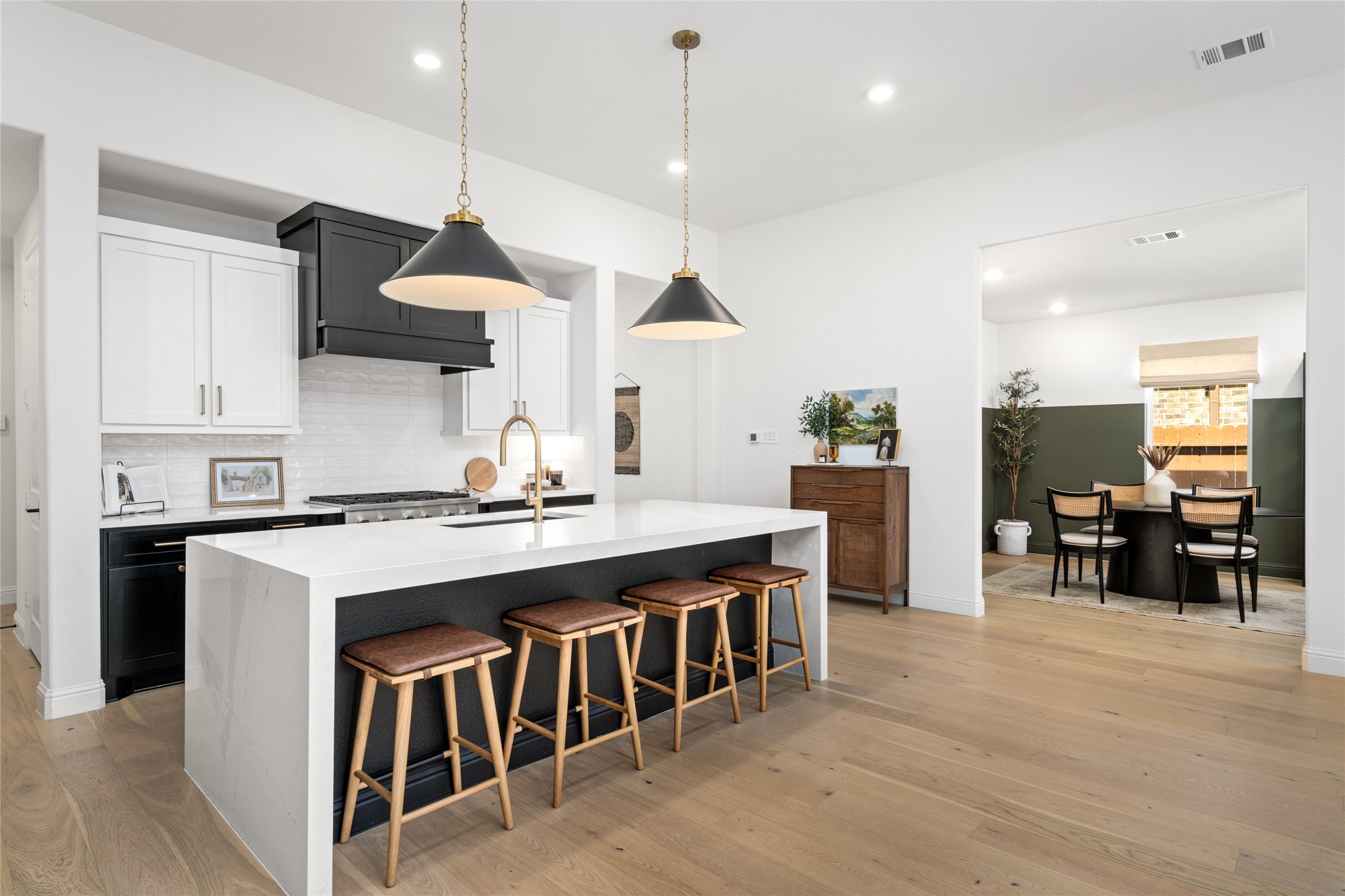 17461 Bayflower Conroe, TX 77385 - Photo 10 of 49 View from the kitchen and living room area into the formal dining room.