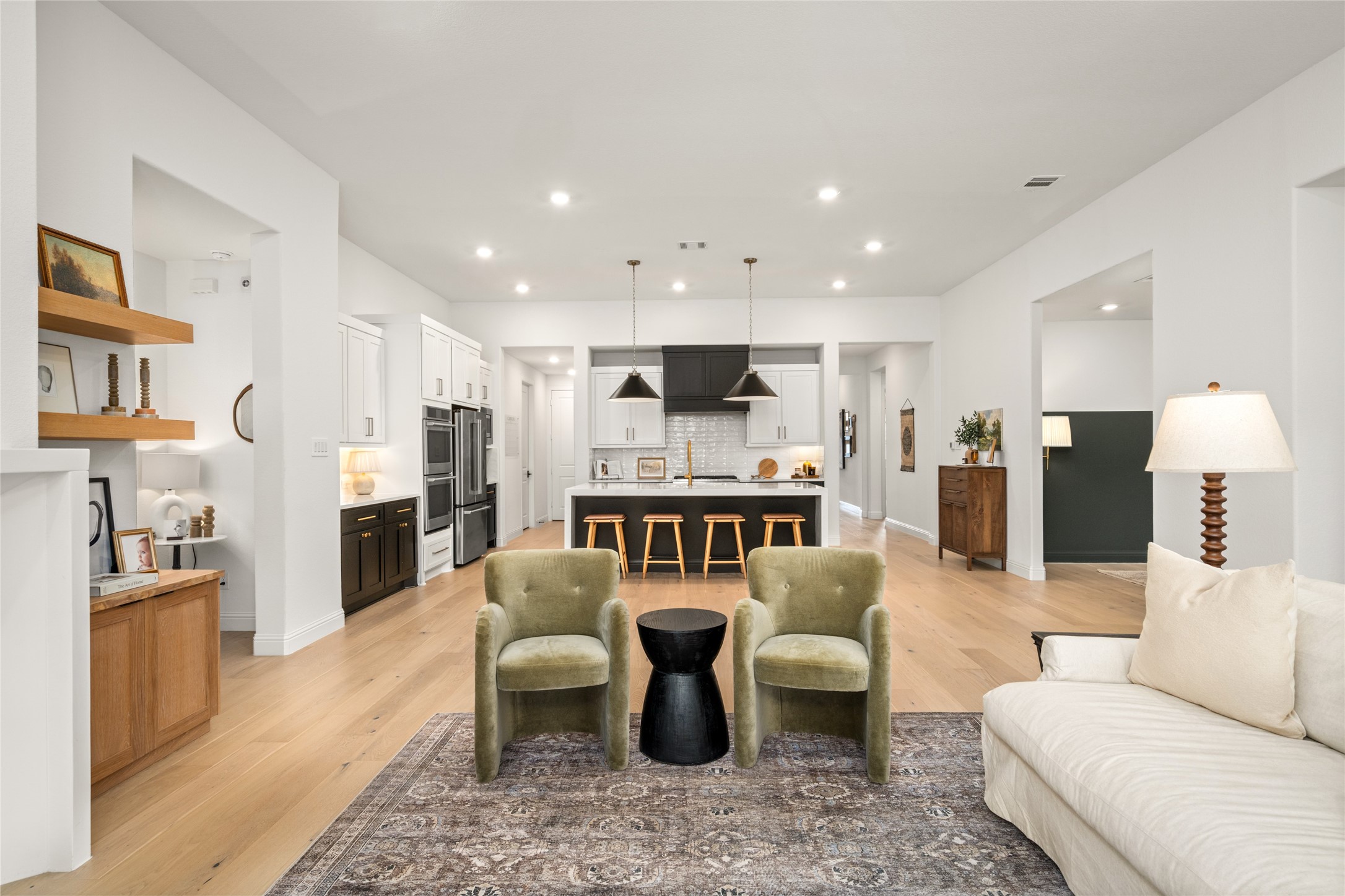 17461 Bayflower Conroe, TX 77385 - Photo 12 of 49 View from the living area showcasing the open flow into the kitchen and dining room.