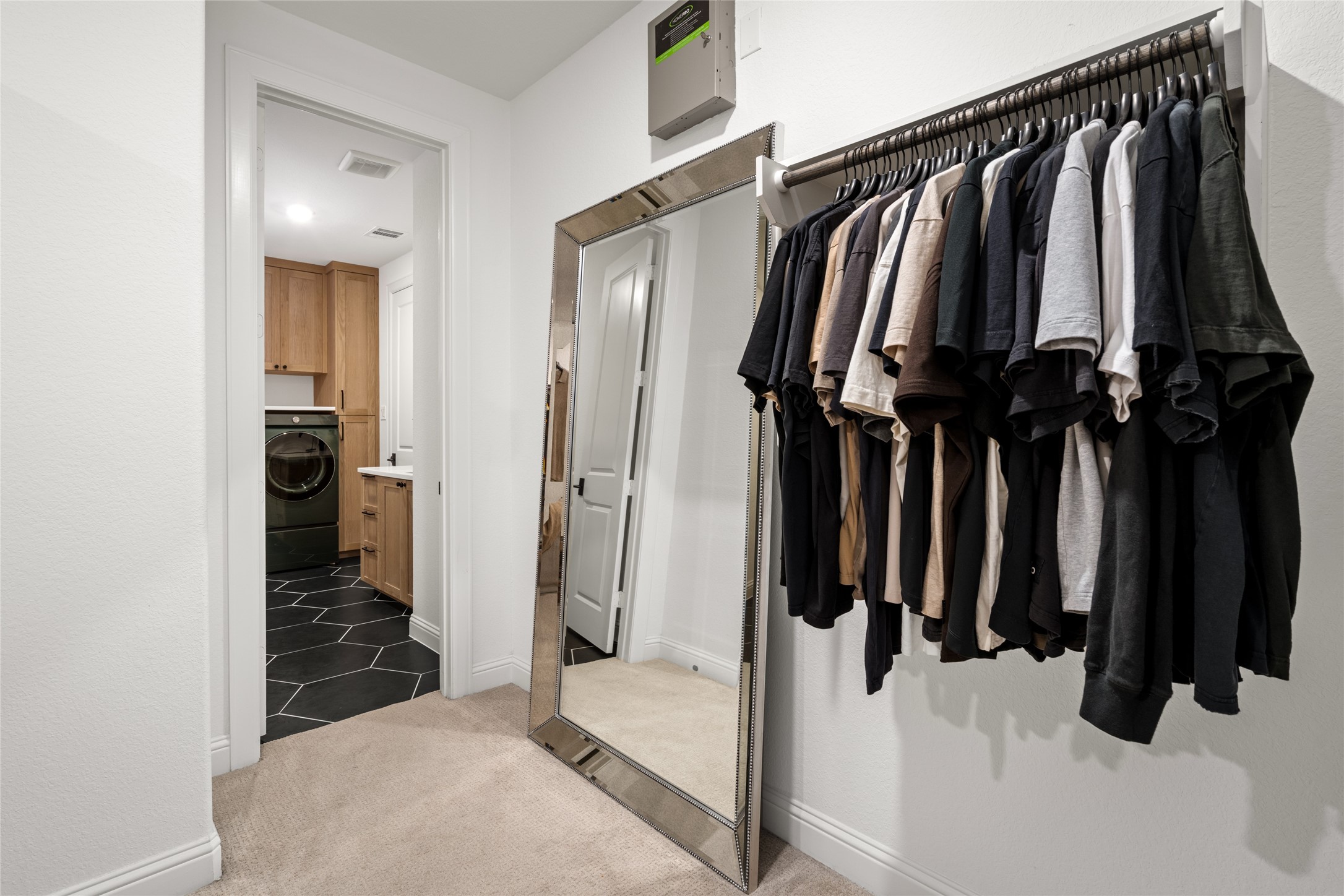 17461 Bayflower Conroe, TX 77385 - Photo 23 of 49 Primary closet with convenient access to the laundry room.