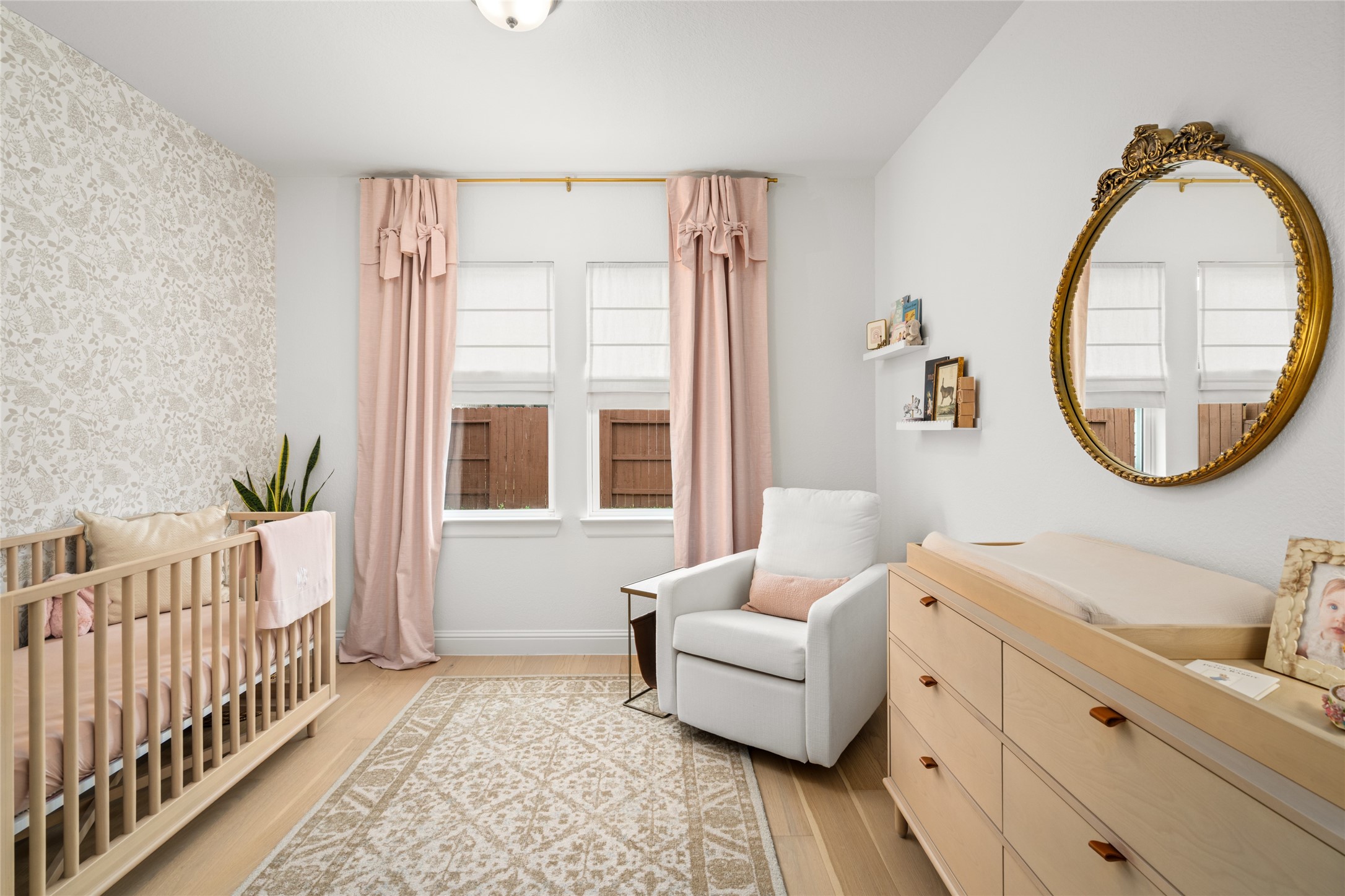 17461 Bayflower Conroe, TX 77385 - Photo 25 of 49 2nd bedroom with engineered hardwood flooring and a neutral accent wall.
