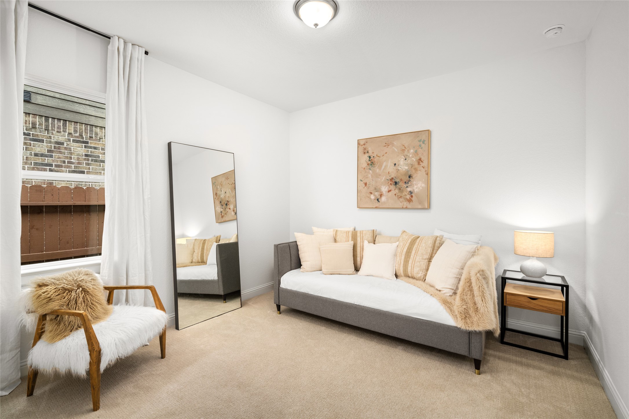 17461 Bayflower Conroe, TX 77385 - Photo 28 of 49 Spacious 3rd bedroom with plush carpeting, soft neutral palette, and abundant natural light.