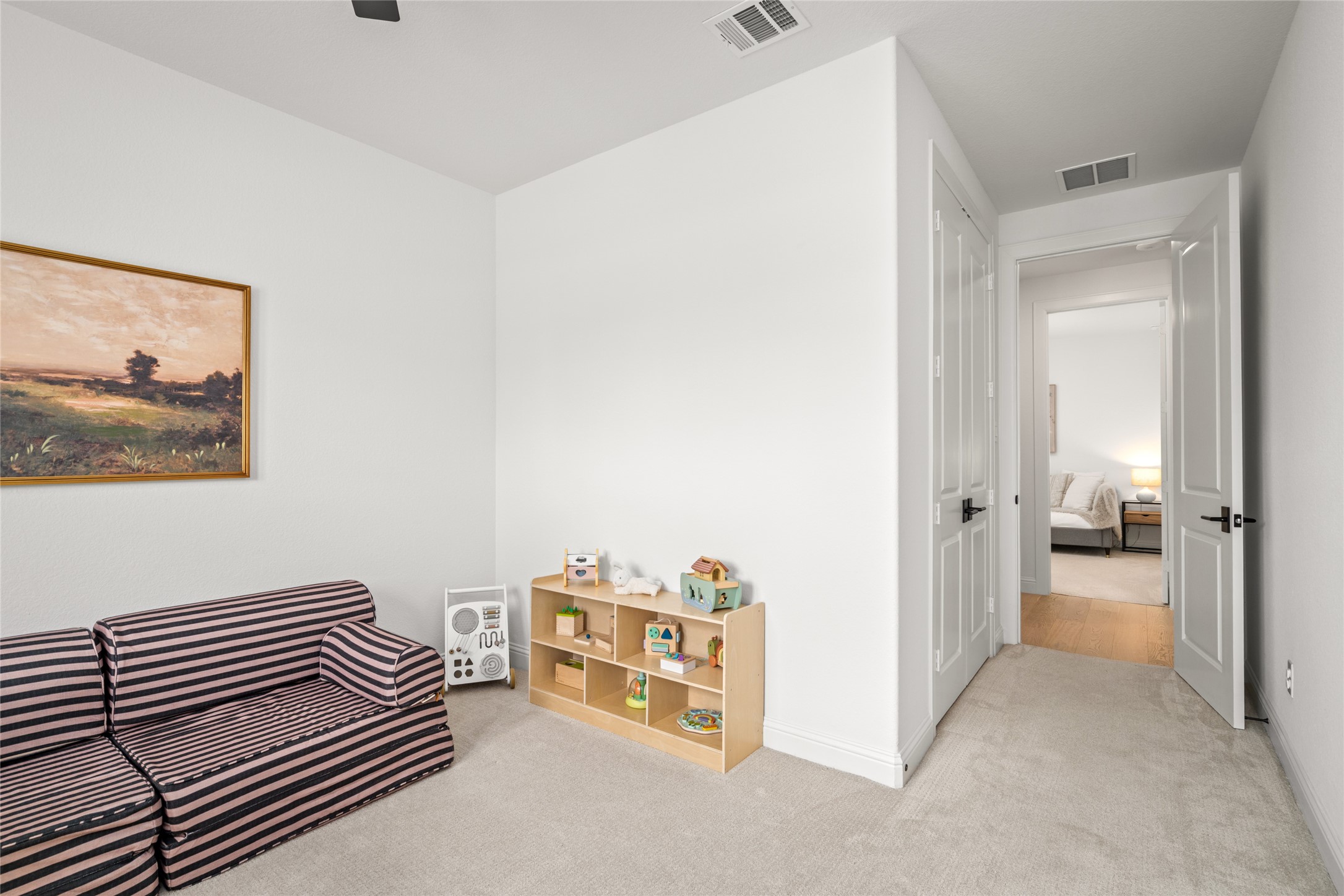 17461 Bayflower Conroe, TX 77385 - Photo 30 of 49 Secondary view of the 4th bedroom showing hallway access to the second full bath and third bedroom.