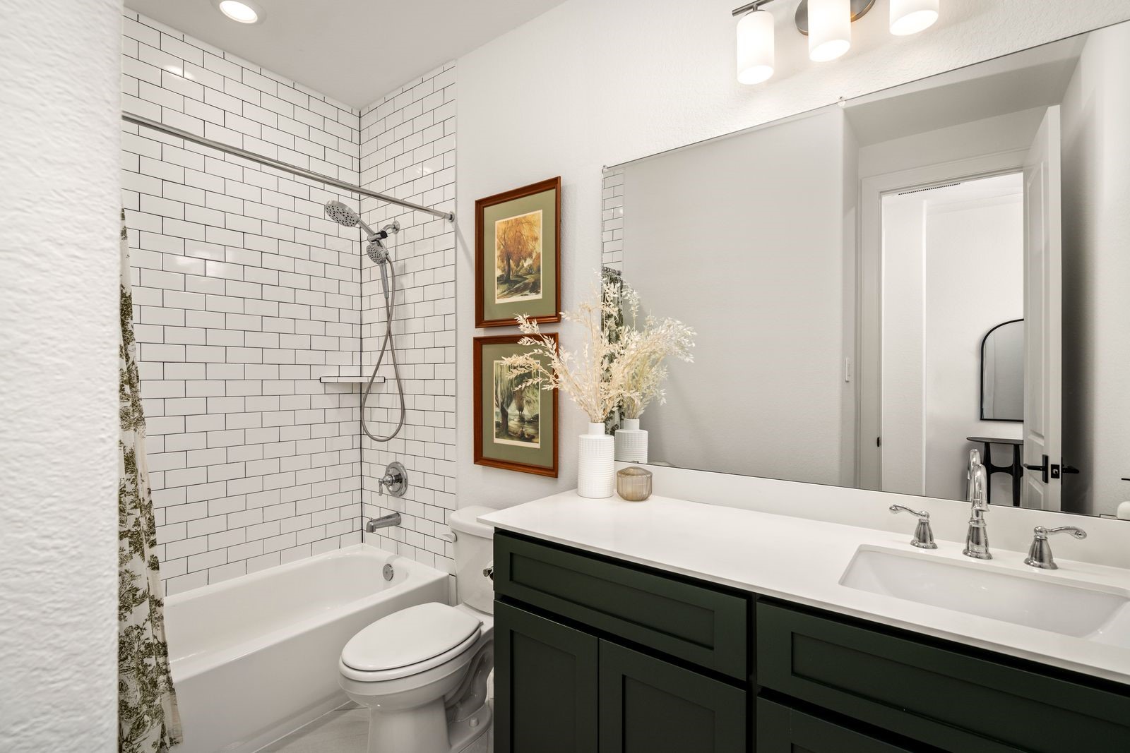 17461 Bayflower Conroe, TX 77385 - Photo 31 of 49 Second full bathroom with subway tile tub surround to the ceiling, located between the 3rd and 4th bedrooms for easy access.