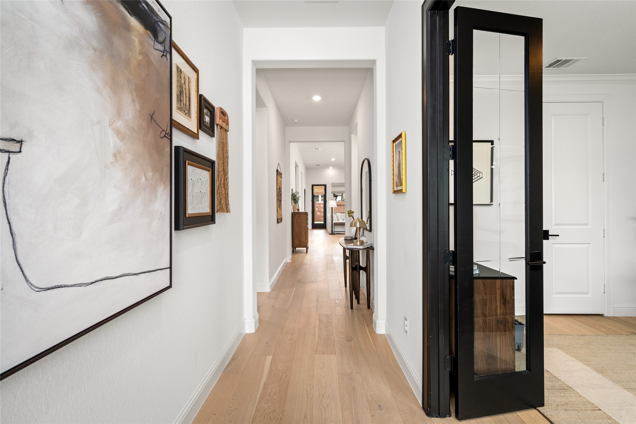 17461 Bayflower Conroe, TX 77385 - Photo 34 of 49 Direct views from the foyer flow seamlessly into the study and extend into the main living areas of the home.