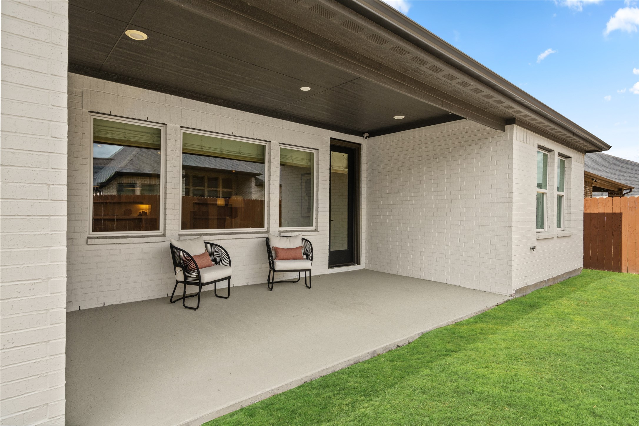 17461 Bayflower Conroe, TX 77385 - Photo 36 of 49 Back patio features a concrete design and epoxy flooring.