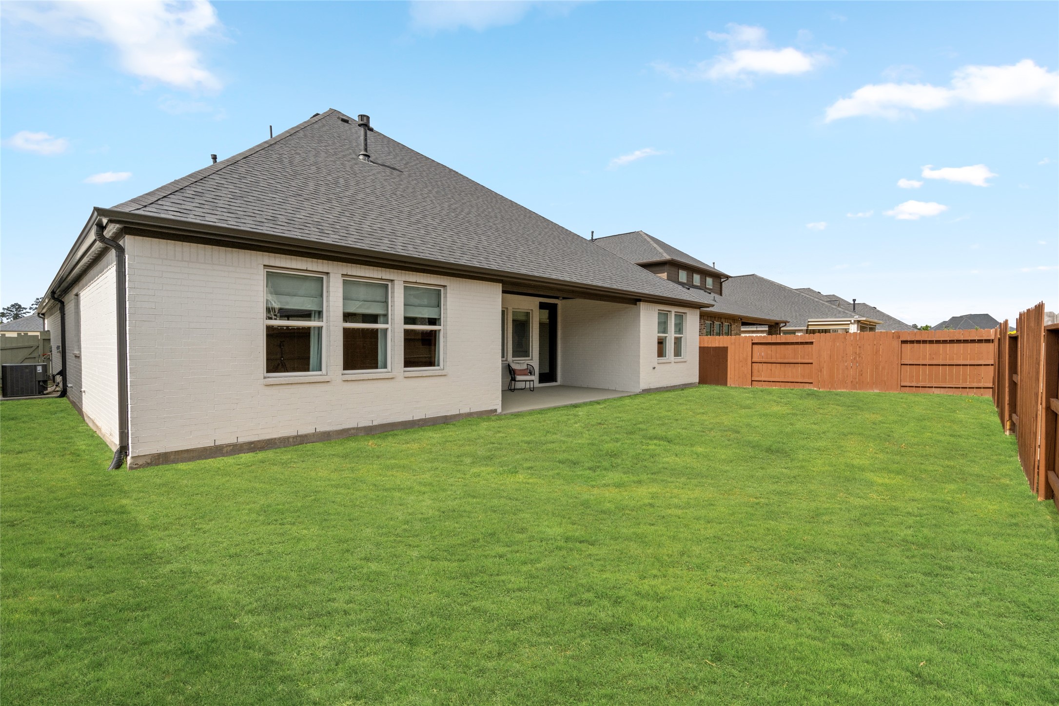 17461 Bayflower Conroe, TX 77385 - Photo 38 of 49 Back view of the home and yard.