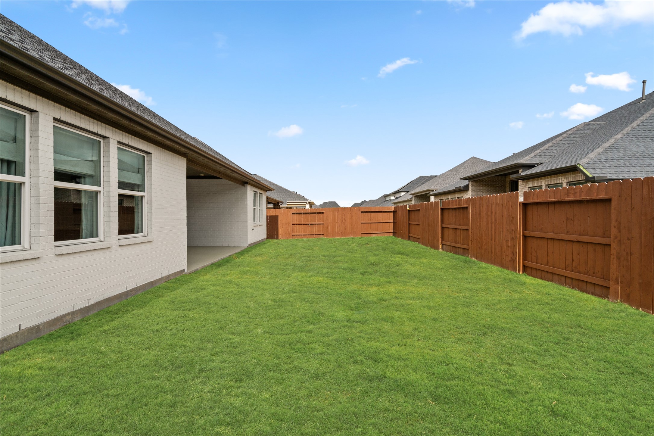 17461 Bayflower Conroe, TX 77385 - Photo 39 of 49 Alternate view of the backyard and rear exterior of the home.