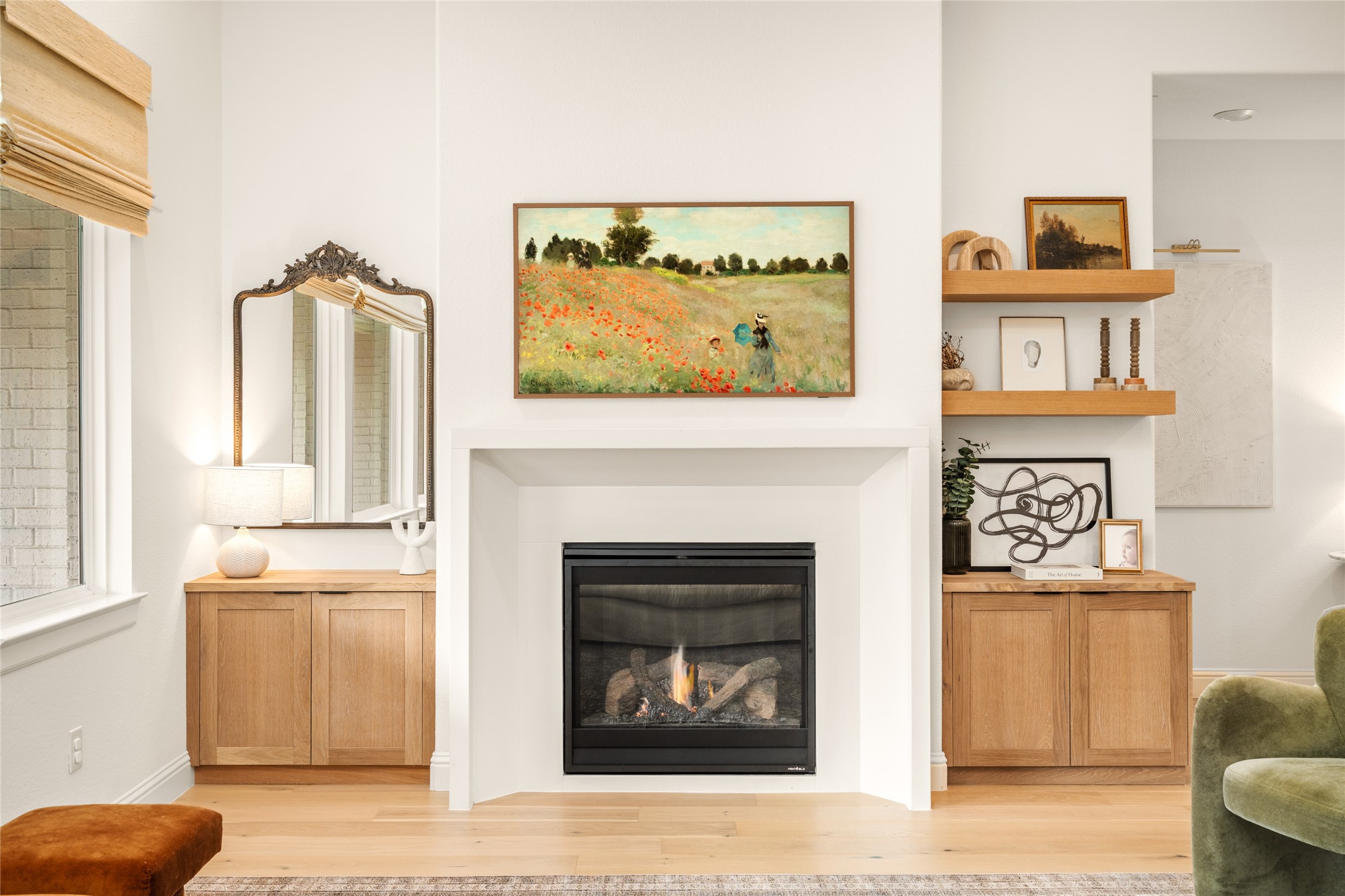 17461 Bayflower Conroe, TX 77385 - Photo 6 of 49 Upgraded cast stone fireplace surround with custom-built-in cabinets and floating shelves.