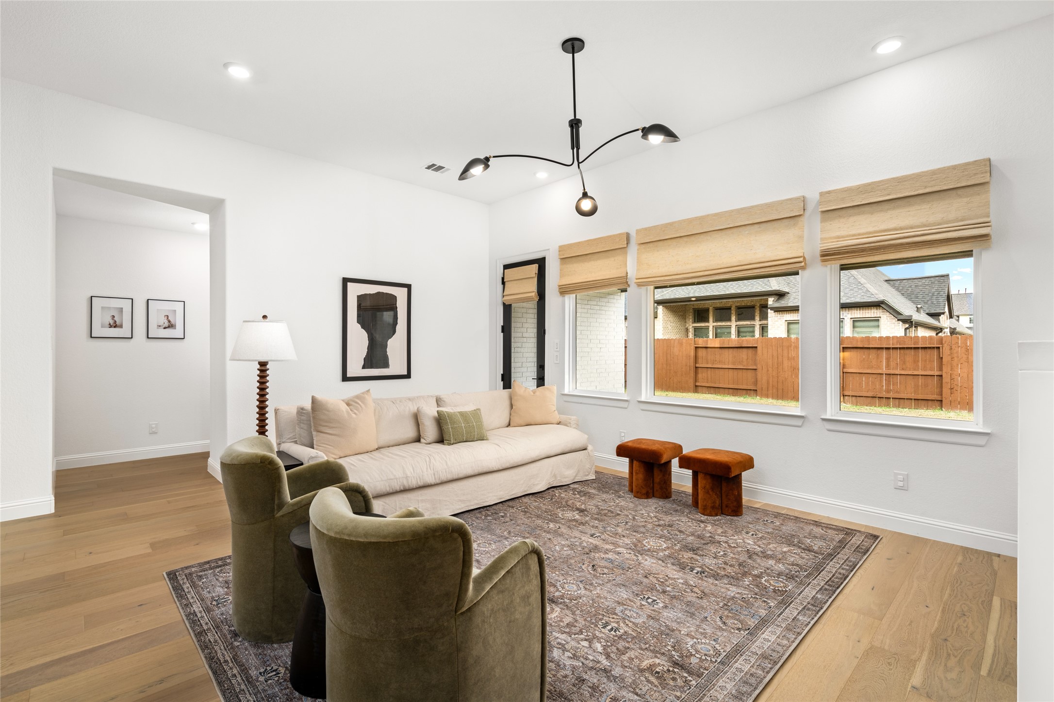 17461 Bayflower Conroe, TX 77385 - Photo 7 of 49 The living room offers seamless access to the backyard patio, making it perfect for indoor and outdoor living.