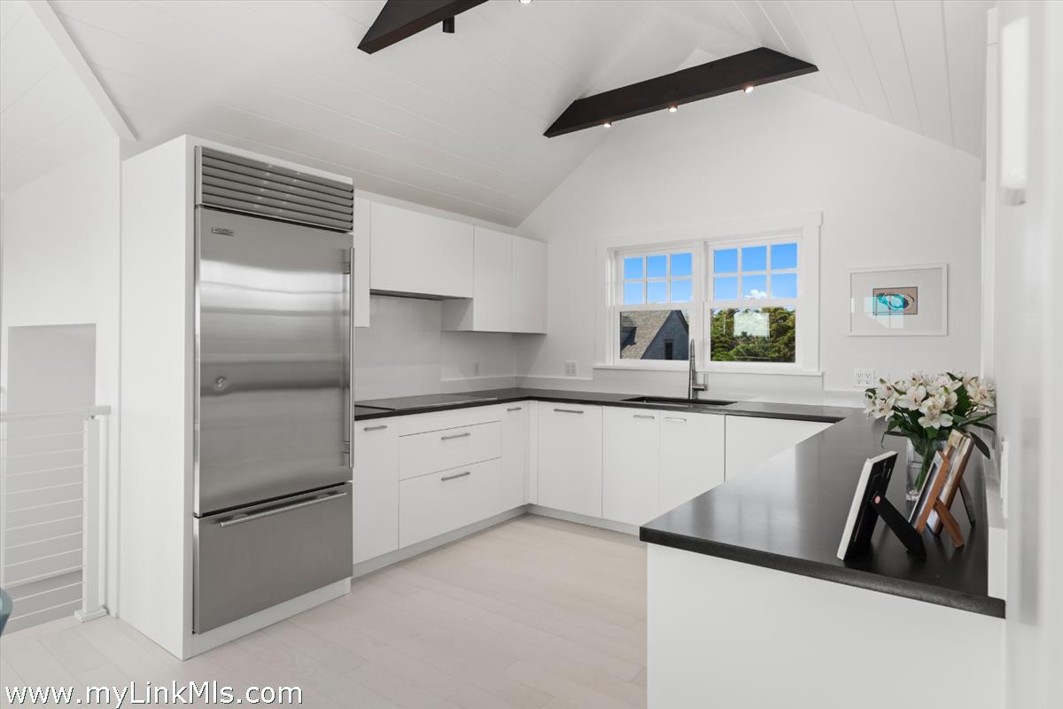 3 Tautemo Way Nantucket, MA 02554 - Photo 25 of 57 a kitchen with a refrigerator and a sink