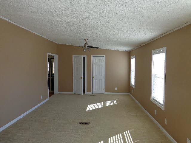 223 Natural Chimney Road Mount Solon, VA 22843 - Photo 11 of 18 an empty room with windows