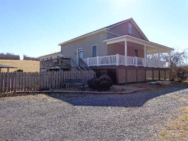 223 Natural Chimney Road Mount Solon, VA 22843 - Photo 3 of 18 a front view of a house with a yard