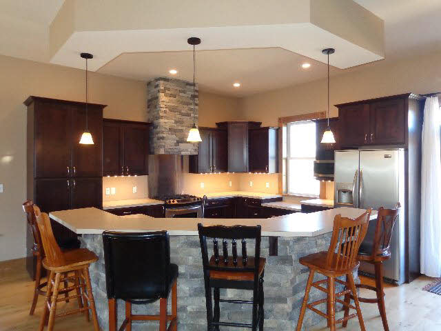 223 Natural Chimney Road Mount Solon, VA 22843 - Photo 5 of 18 a kitchen with a dining table chairs stainless steel appliances and cabinets