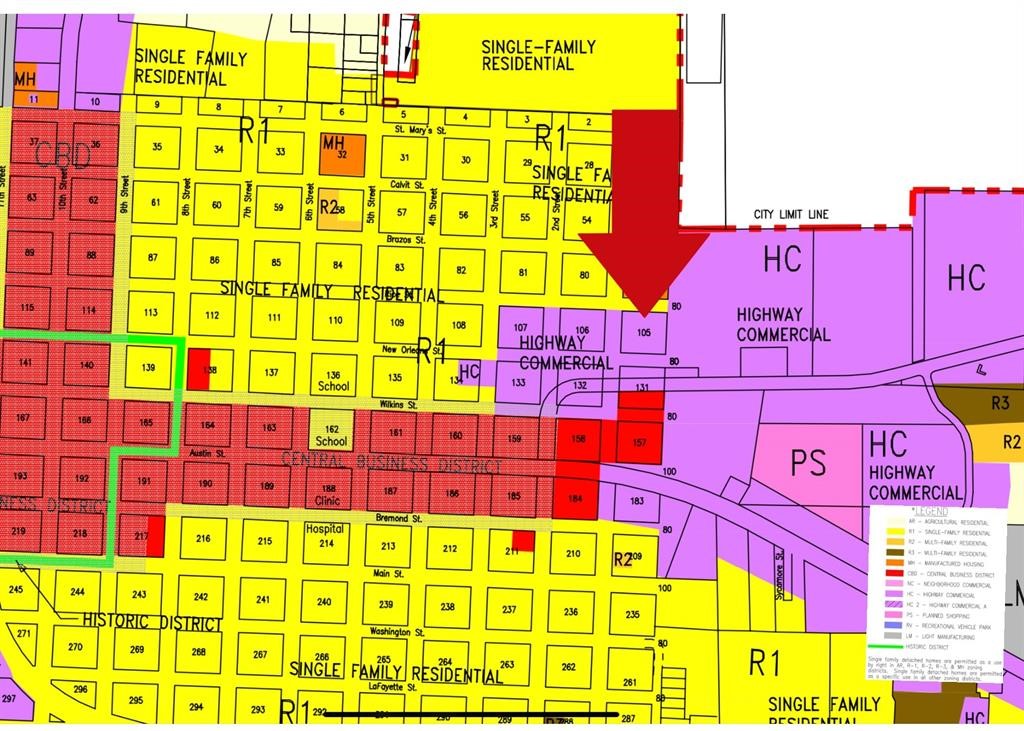 6-10 Block 105 Hempstead, TX 77445 - Photo 3 of 6 a sign that is on a brick building