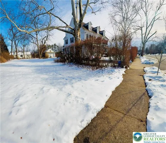 a view of large yard with a house