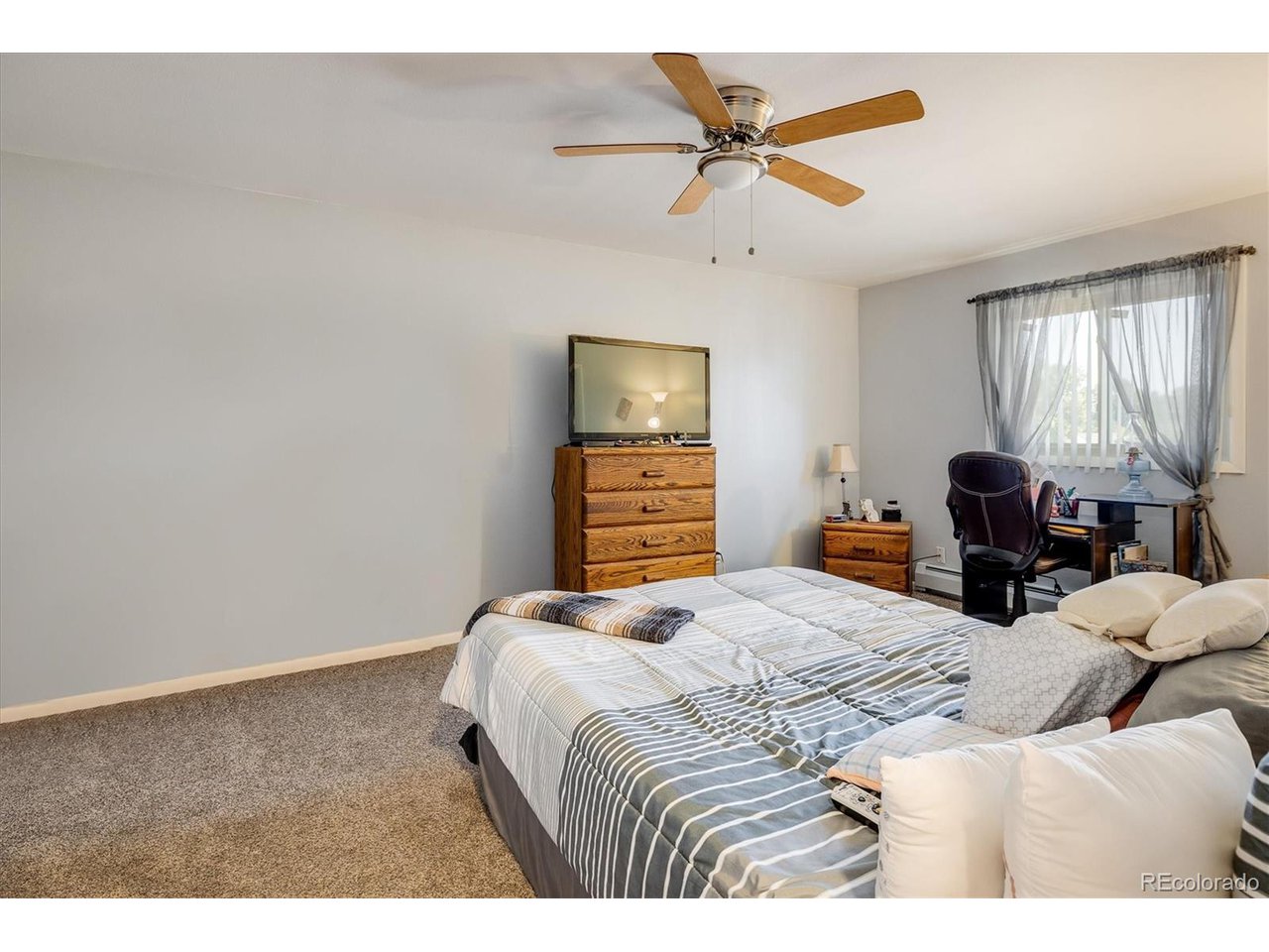 3830 Otis Street, Unit 4 Wheat Ridge, CO 80033 - Photo 11 of 26 Large Primary Bedroom.