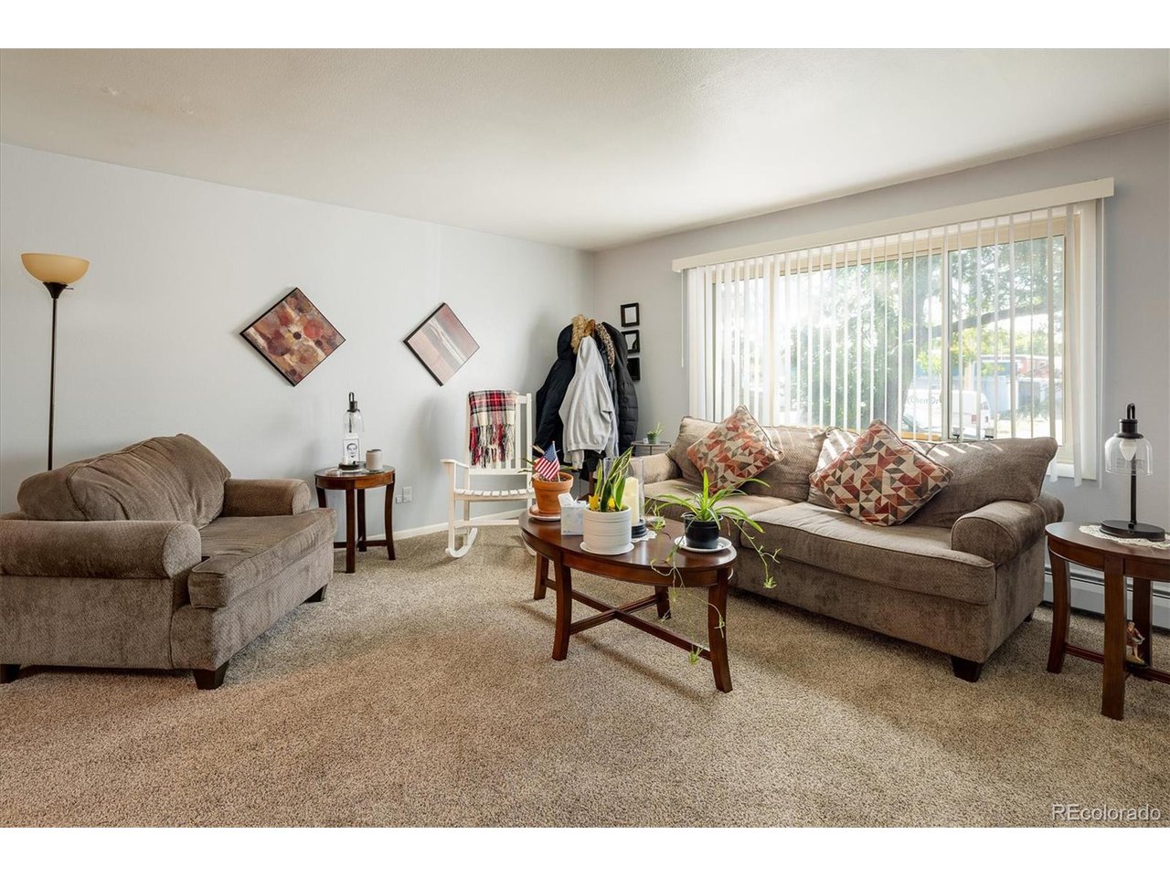 3830 Otis Street, Unit 4 Wheat Ridge, CO 80033 - Photo 3 of 26 Living room with an abundance of natural light.