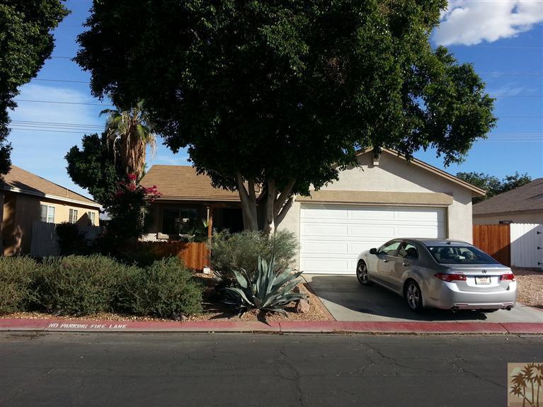 47800 Madison Street, Unit 99 Indio, CA 92201 - Photo 13 of 13 a view of a car parked in front of a house