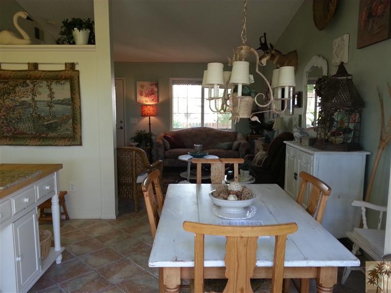 47800 Madison Street, Unit 99 Indio, CA 92201 - Photo 3 of 13 a view of a dining room with furniture