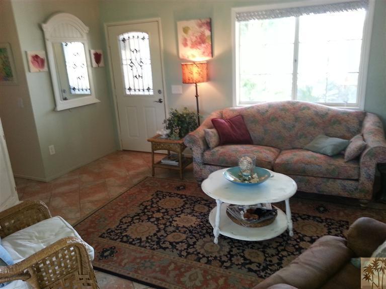 47800 Madison Street, Unit 99 Indio, CA 92201 - Photo 4 of 13 a living room with furniture and a window