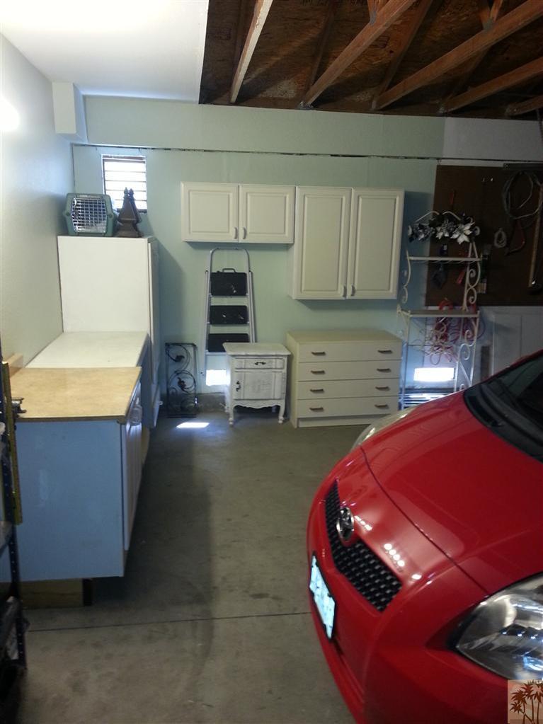 47800 Madison Street, Unit 99 Indio, CA 92201 - Photo 7 of 13 a room with furniture and flat screen tv