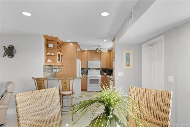 a dining room with furniture and a window