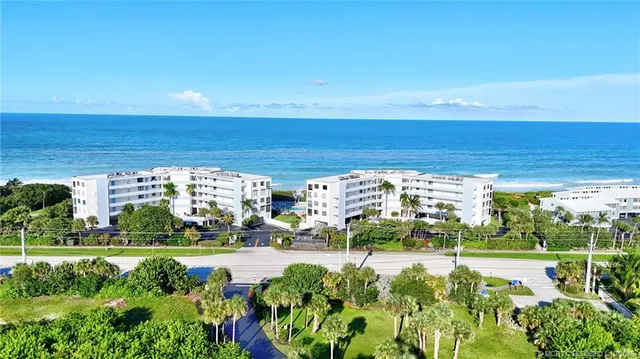 a view of building with swimming pool and sitting space