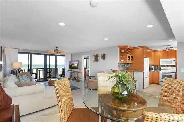 a kitchen with stainless steel appliances granite countertop a sink a stove and refrigerator