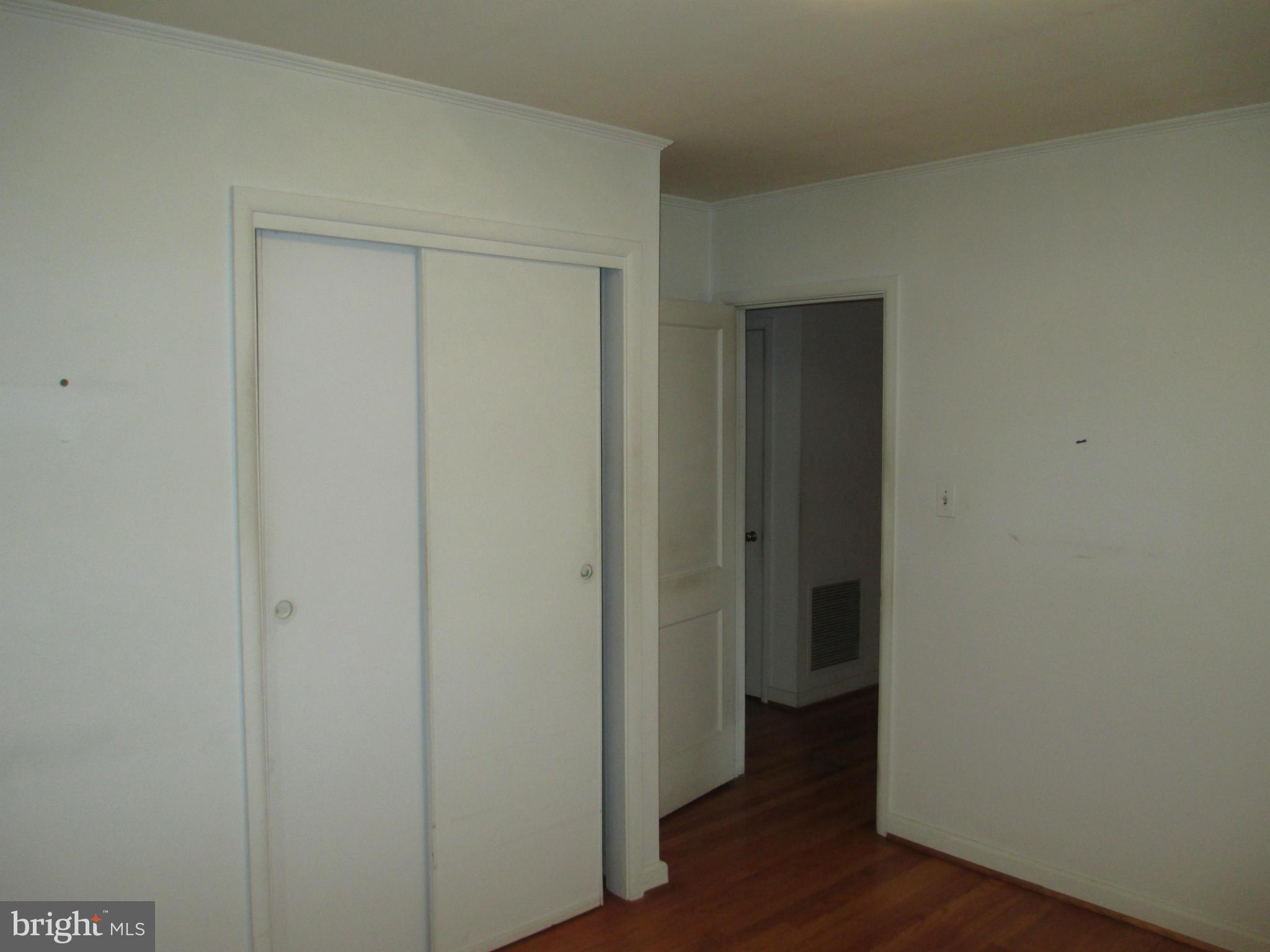 7426 Remoor Road Baltimore, MD 21207 - Photo 11 of 28 a view of an empty room with wooden floor