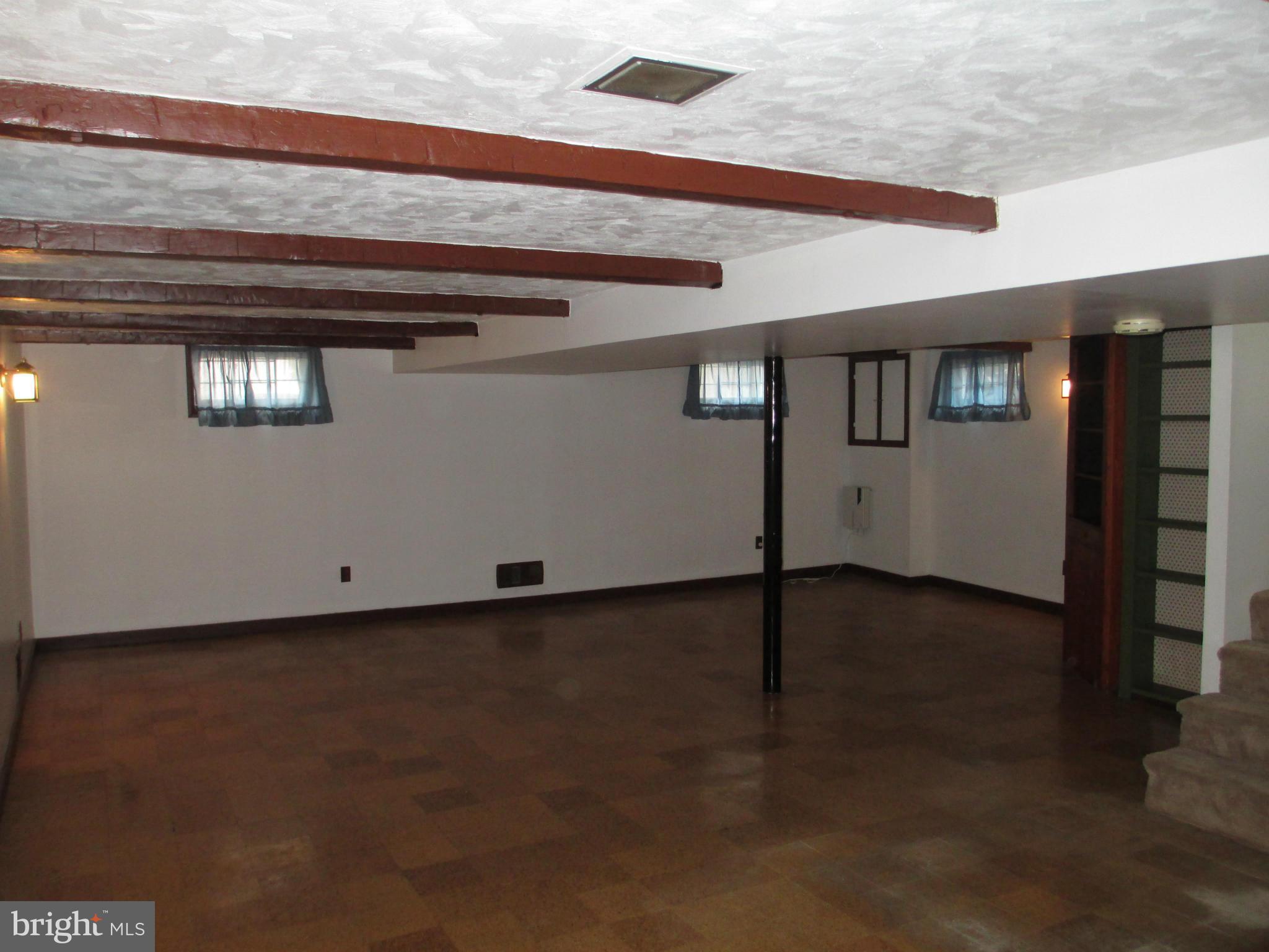 7426 Remoor Road Baltimore, MD 21207 - Photo 17 of 28 a view of a livingroom with wooden floor and window