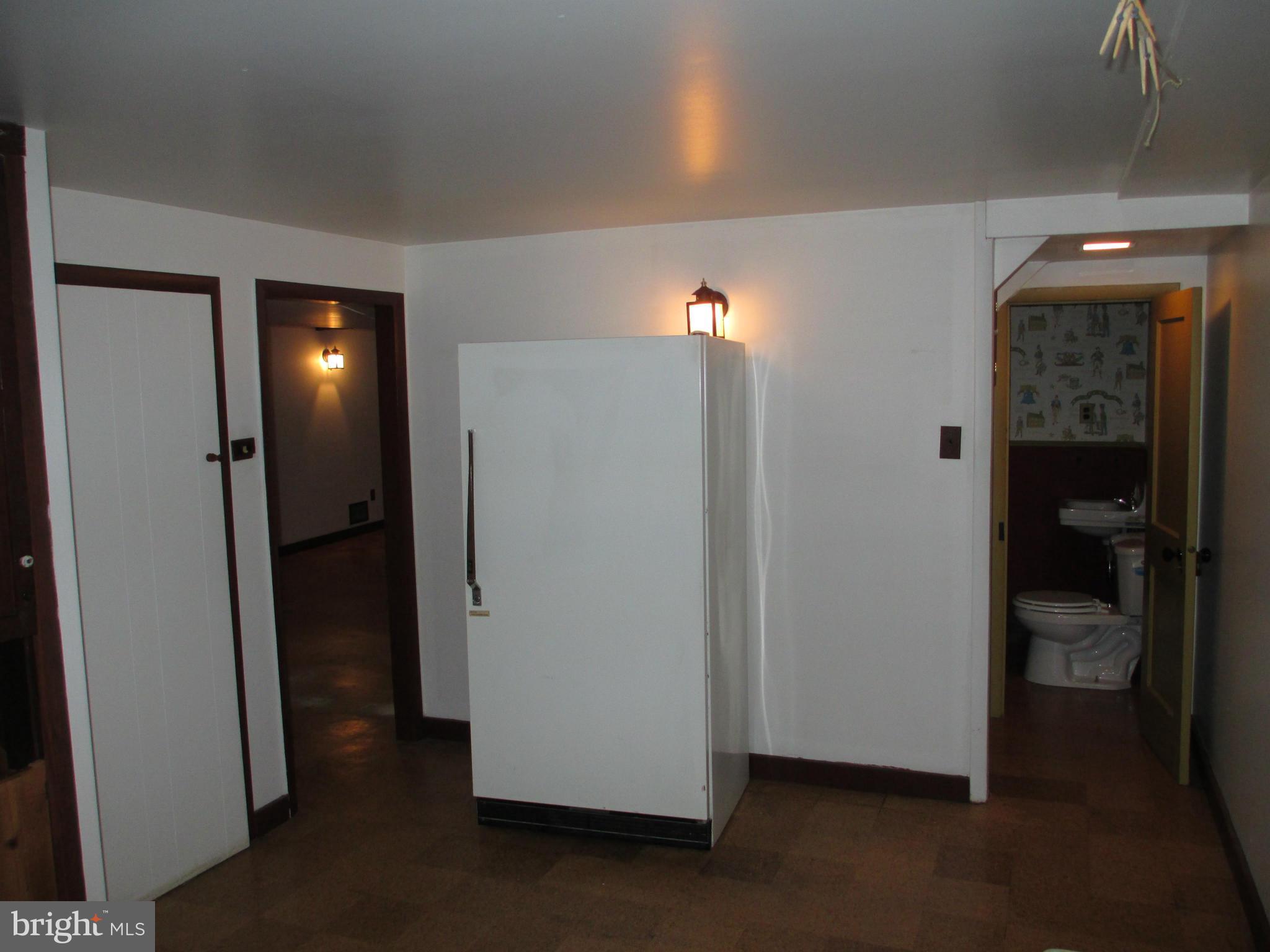 7426 Remoor Road Baltimore, MD 21207 - Photo 22 of 28 a view of a hallway with closet and a living room