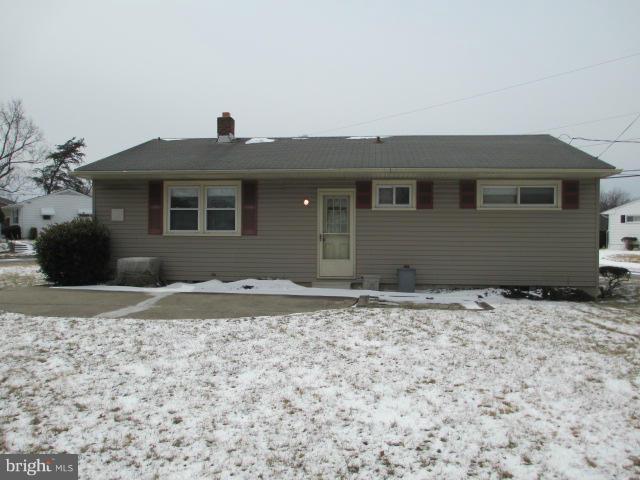 7426 Remoor Road Baltimore, MD 21207 - Photo 26 of 28 a front view of a house with a yard