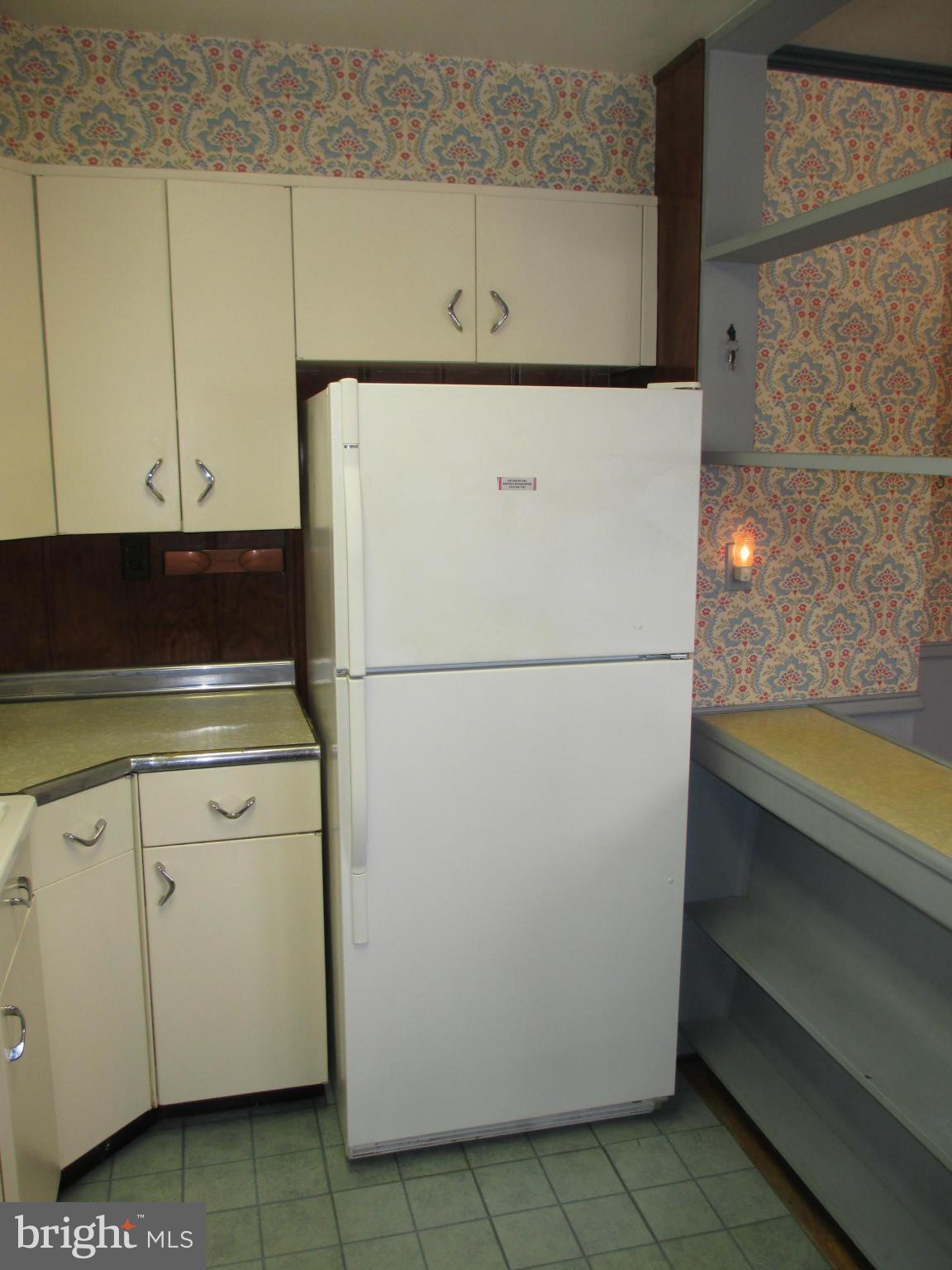 7426 Remoor Road Baltimore, MD 21207 - Photo 8 of 28 a view of storage and utility room with washer and dryer