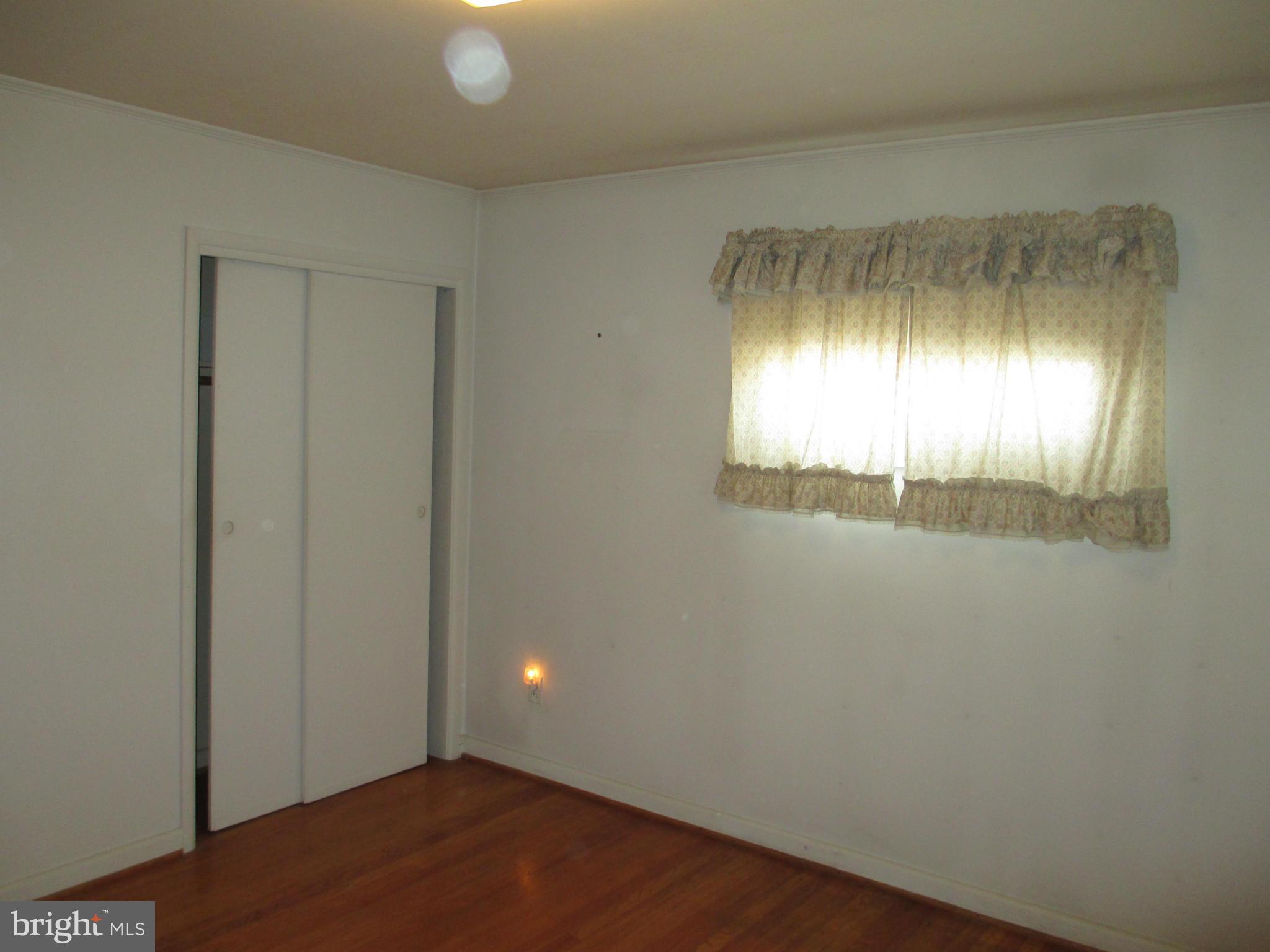 7426 Remoor Road Baltimore, MD 21207 - Photo 10 of 28 an empty room with a window