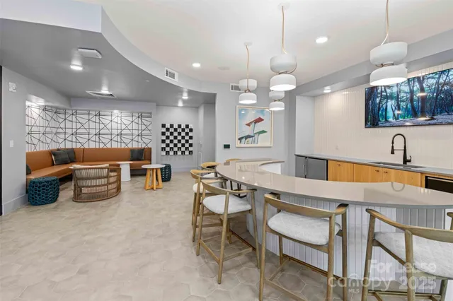 a kitchen with a table and chairs in it