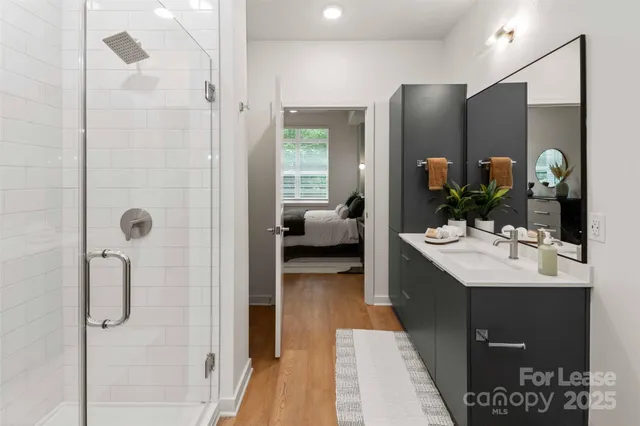 a bathroom with a sink vanity and mirror