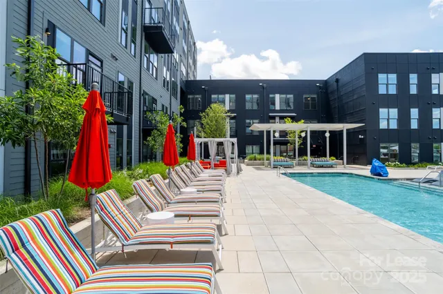 a view of lawn chairs and tables in the patio