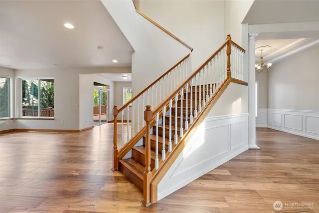 an entryway in a hall with an entryway and wooden floor