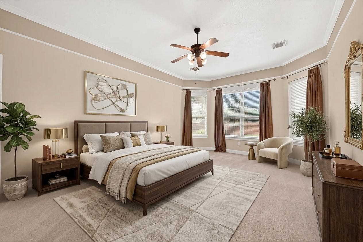 4203 Deforest Ridge Circle Katy, TX 77494 - Photo 21 of 50 Spacious and serene primary suite featuring a private sitting area, elegant crown molding, and walls of windows that fill the room with natural light (virtually staged)