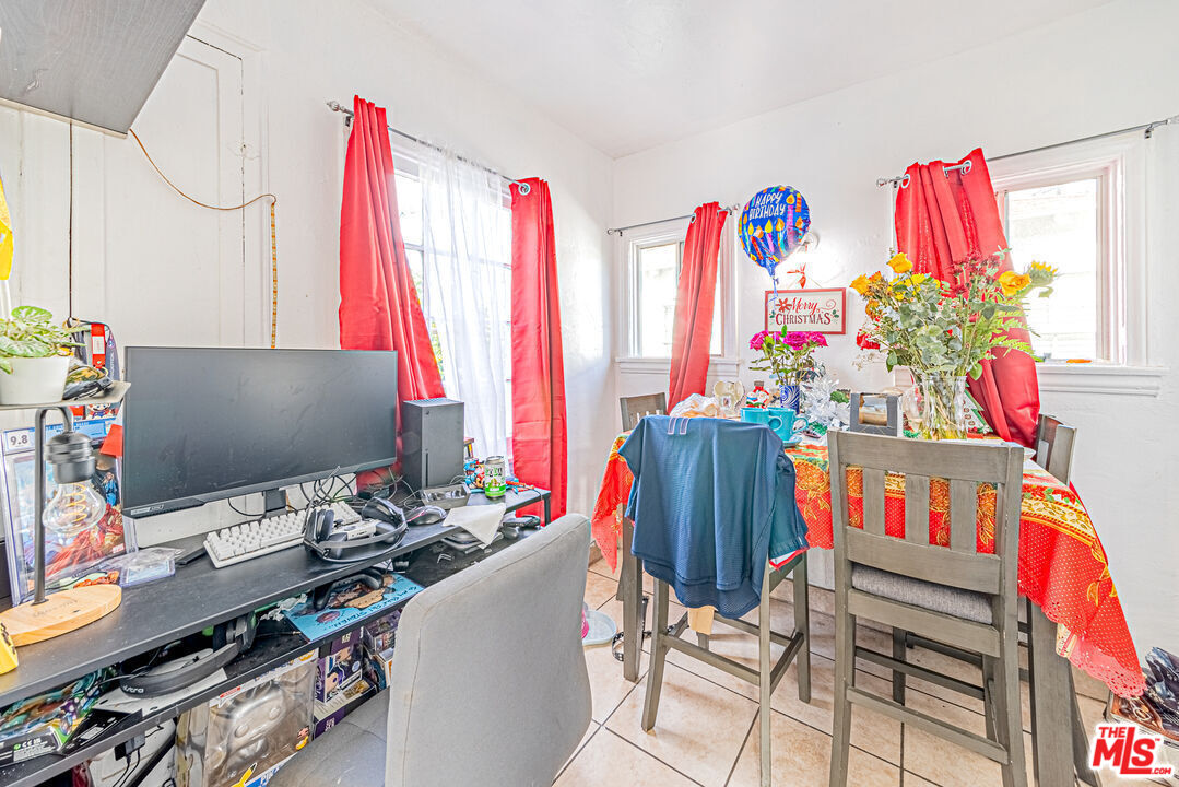 1618 South Burnside Avenue Los Angeles, CA 90019 - Photo 9 of 43 a living room with furniture and a flat screen tv