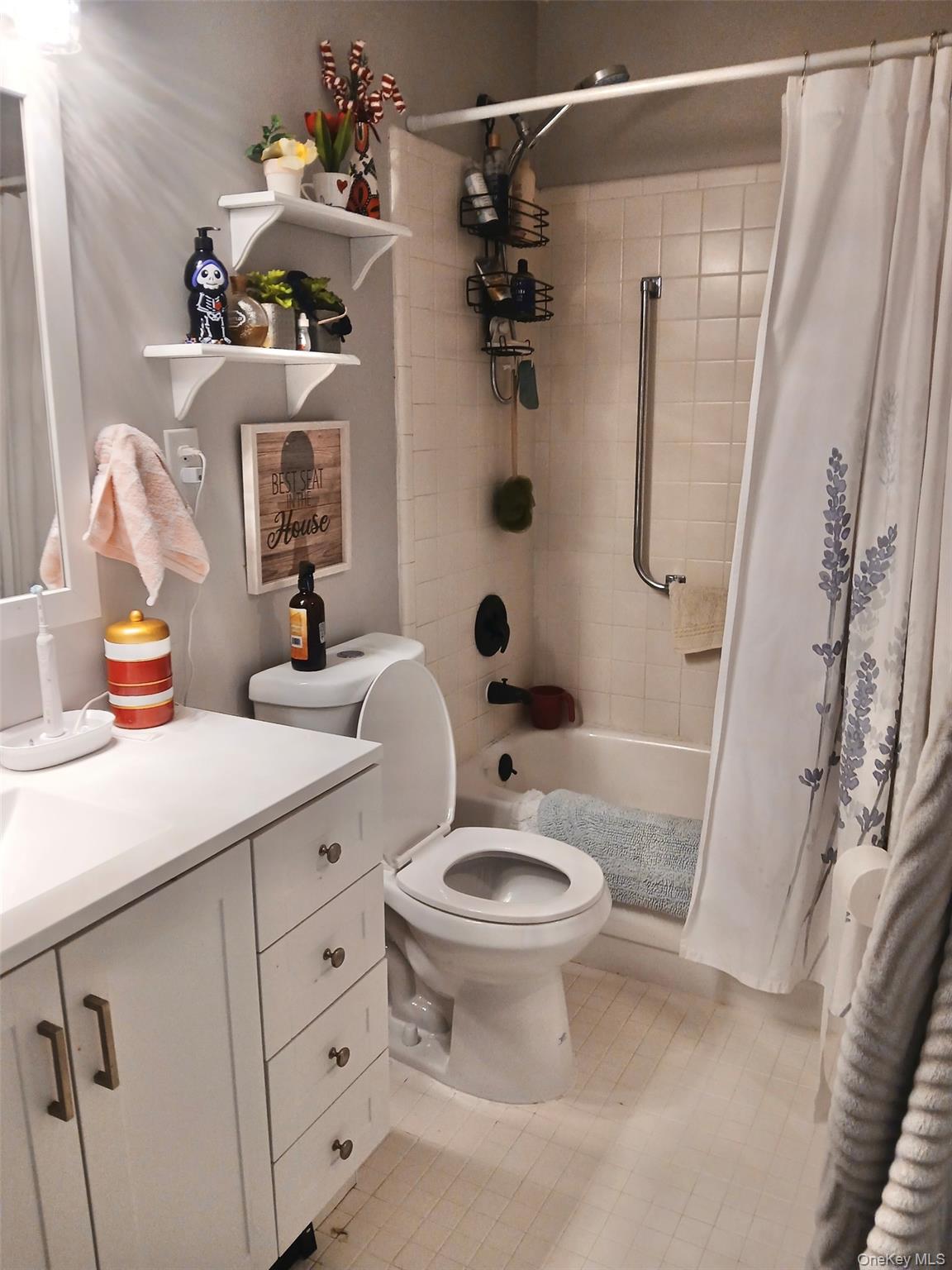427 Aylesbury Court, Unit A Ridge, NY 11961 - Photo 12 of 16 a bathroom with a sink a toilet and shower