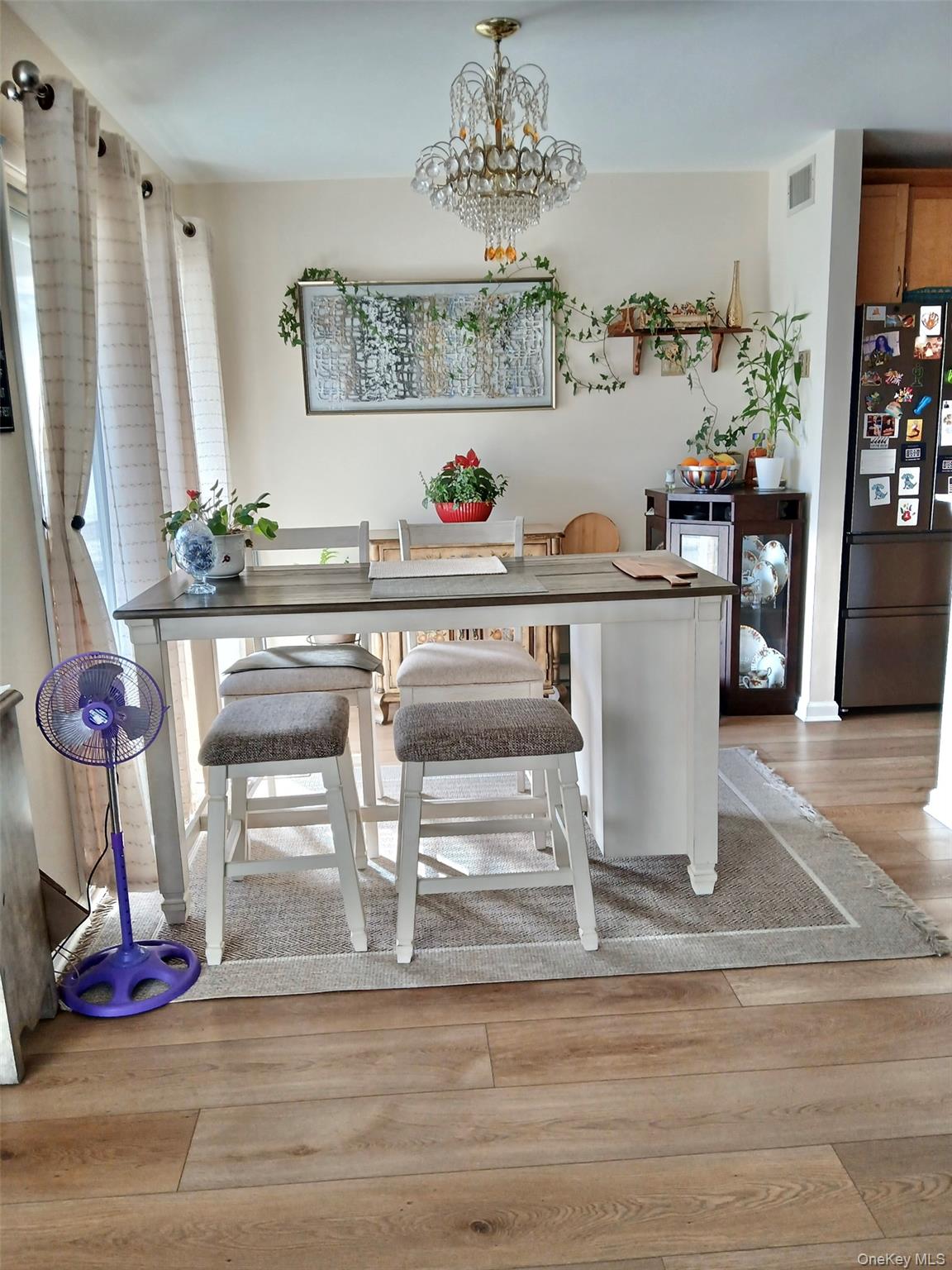 427 Aylesbury Court, Unit A Ridge, NY 11961 - Photo 5 of 16 a view of living room with furniture and wooden floor