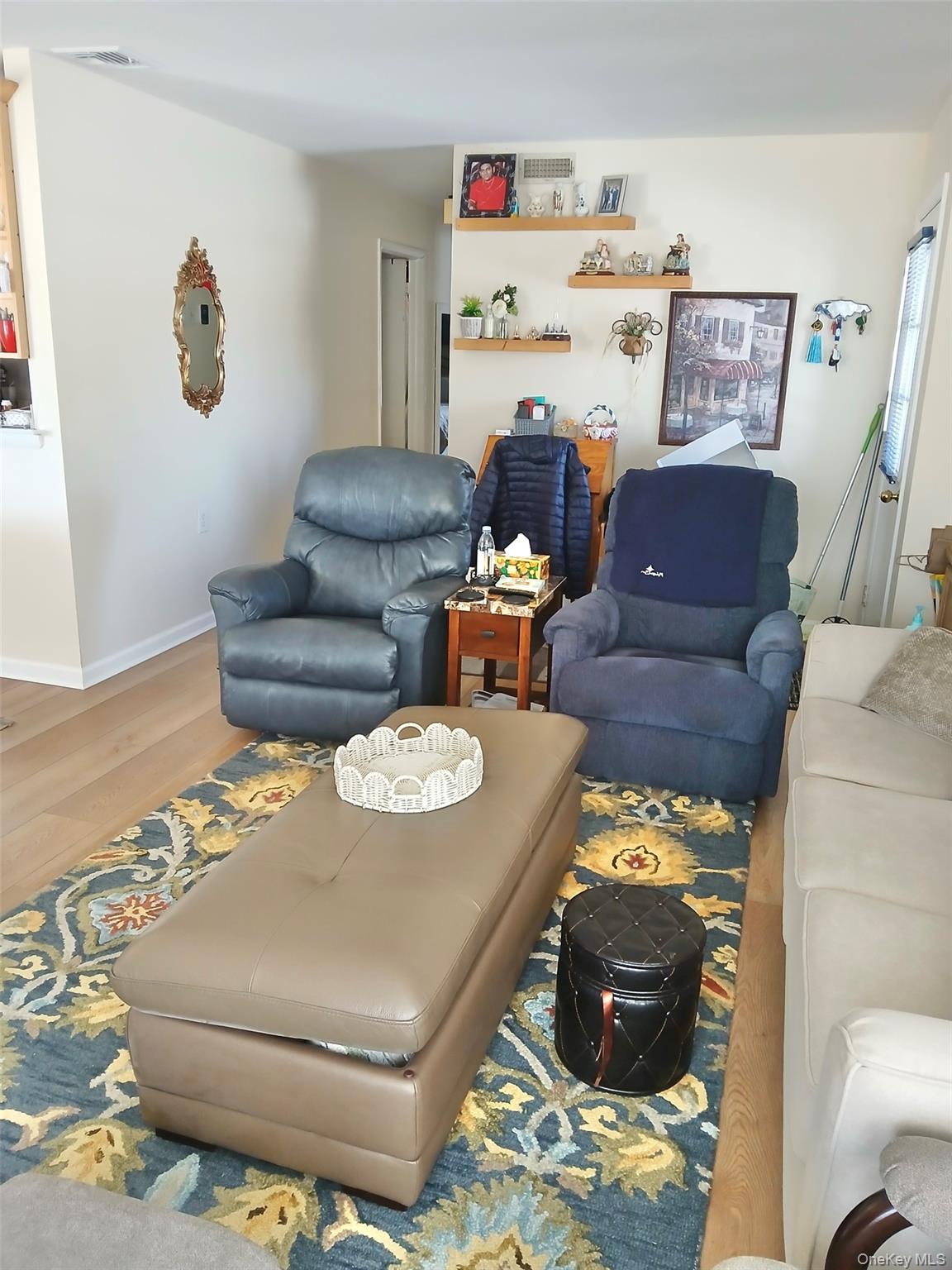 427 Aylesbury Court, Unit A Ridge, NY 11961 - Photo 7 of 16 a living room with furniture and a rug