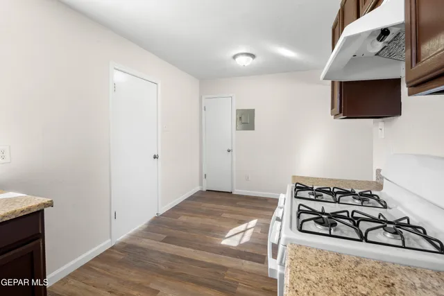 a bedroom with a stove and a microwave