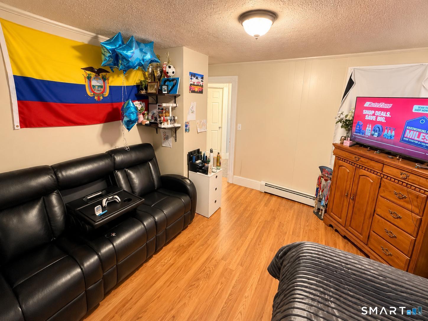 98 Huntington Road Bridgeport, CT 06608 - Photo 11 of 15 a living room with furniture and a couch